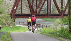 Riding under a railway bridge on the way back to the Petroleum Center trail head