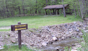 At about the midpoint of the trail is a picnic area with outhouse facilities.  There is also access to hiking trails here, one of which goes to an overlook